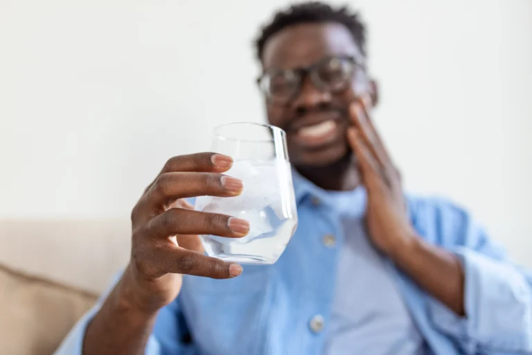 Tooth sensitivity pain triggered by cold water drink in adult patient